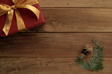 pine cones and gifts on vintage wooden background, winter mood