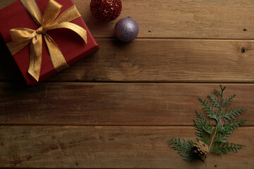 pine cones and gifts on vintage wooden background, winter mood