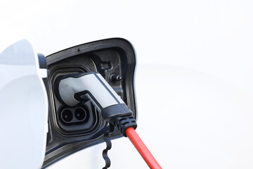 Power cable pump plug in charging power to electric vehicle EV car with modern technology UI...