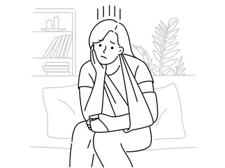 Upset woman with broken arm sit at home 