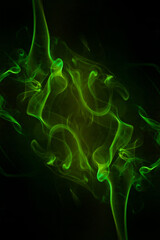 Green smoke motion on black background.