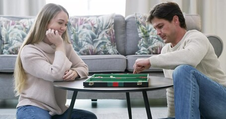 Love, couple and board game together on floor in living room for happy quality time, relax entertainment or marriage happiness. Game, competition and man roll dice for backgammon challenge with woman
