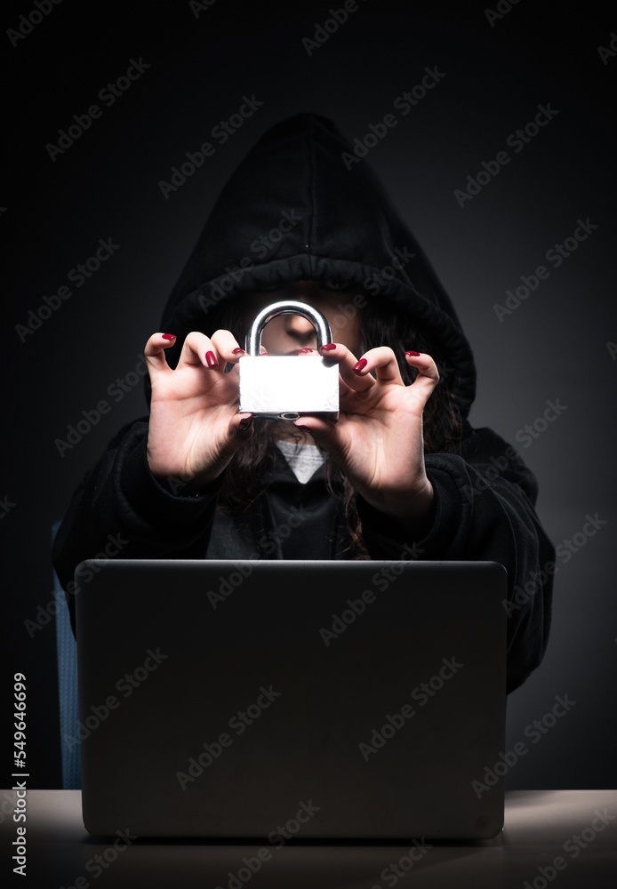 Poster female hacker hacking security firewall late in office