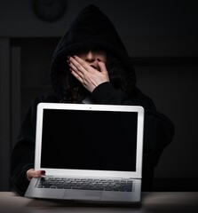 Female hacker hacking security firewall late in office