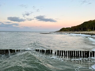 Fototapeta premium A wooden breakwater on the Baltic Sea protecting the shore from the waves