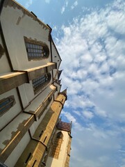 Fototapeta na wymiar Cathedral to the blue cloudy sky