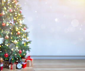 Christmas background with an elegant Christmas tree with gifts. blurred lights. Christmas photo with copy space, Christmas tree and packaged gifts