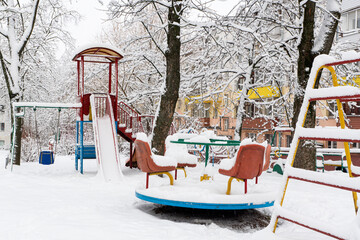 Children's playground covered with snow. Winter