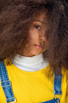 Afro girl staring with blank expression