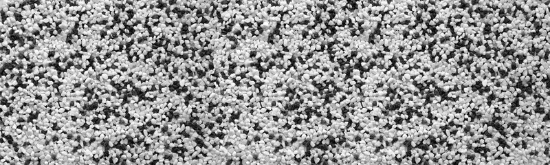 Black and white crushed stone wide texture. Panoramic textured background