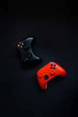 Two gamepads on a black background. Game concept, esports, leisure, gaming industry, video games. Flat lay, top view © Мария Охметзянова