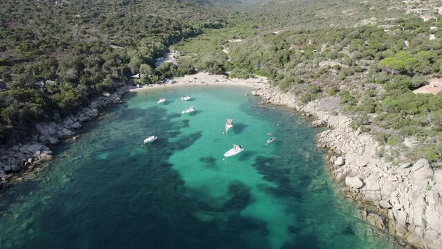 Tizzano Beach Las Cricas cove on French Corsica Island Mediterranean Sea with boats and tourists bathing, Aerial look down approach shot