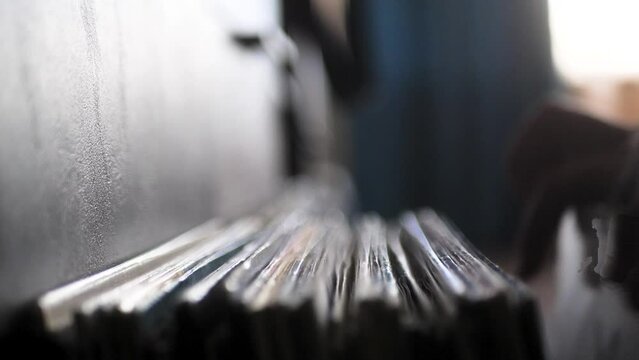 Looking Through Vinyl Records. Man Choosing Music to listen. Close up of hands flipping through vinyl records. Scene A.