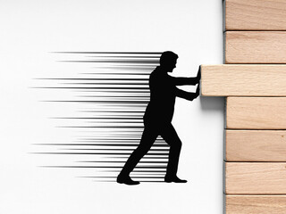 Stability, reliability, balance, risk management and prevention in business. Silhouette of a business person stopping and placing a wooden block in line with others.