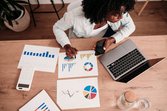 Businesswoman working at desk in home office