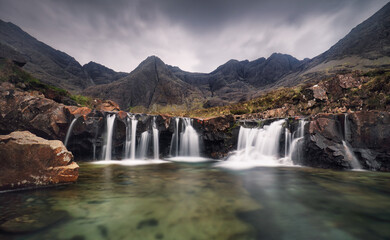 Fototapeta na wymiar Isle of Skye - Fairy pool waterfall in Scotland, UK