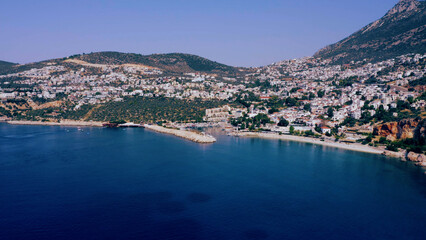 Aerial panoramic view of blue sea, cityscape and mountains. Panorama of coastal town at Turkey.