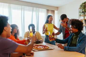 Excited friends bonding at home.