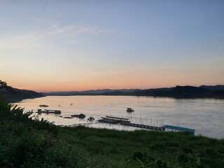 sunset and mountain view on khong river at Thailand and Laos border