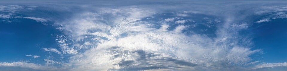 Dark blue sunset sky panorama with golden Cumulus clouds. Seamle