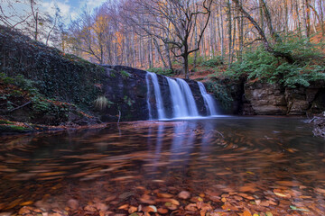 Waterfall view in autumn. The autumn colors surrounding the waterfall offer a visual feast. colorful leaves of autumn. Suuctu waterfalls, Bursa, Turkey.