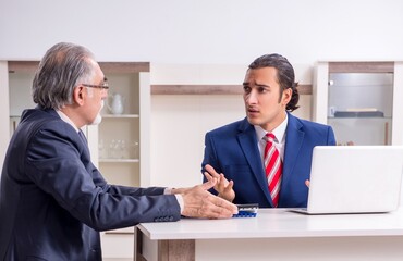 Fototapeta na wymiar Two businessman discussing business in office