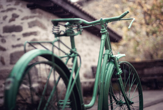 Sculpture of a green painted bicycle in the rain, Erriberabeitia, Araba, Basque Country, Spain