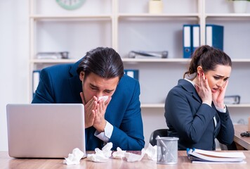 Two employees suffering at workplace