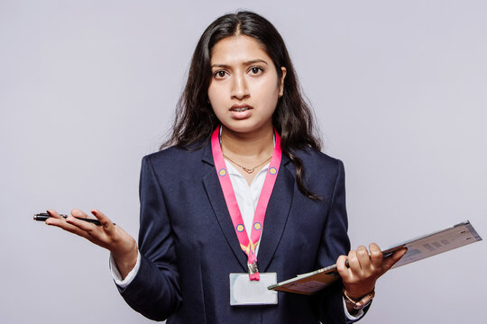 Fired Unexpected Surprised Facial Expression recession Unhappy pissed off young Indian woman frustrated by the indiscipline in isolated background.