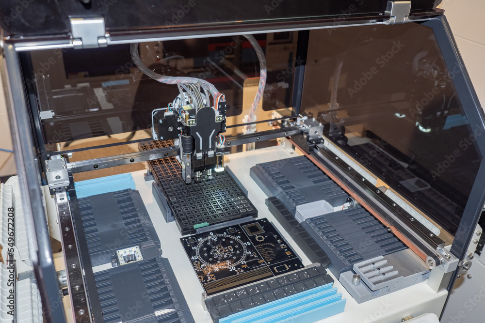 Poster process of creating printed circuit board. computer board inside manufacturing equipment. 3d printer