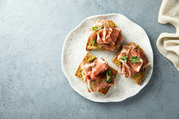Toasts with ham and pesto
