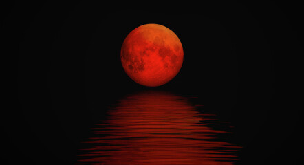 Full moon rising over empty ocean at dark night 