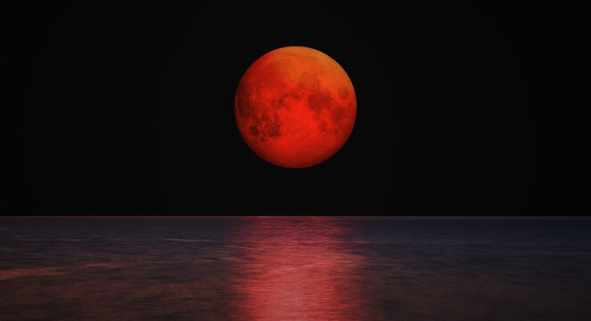 Full moon rising over empty ocean at dark night "Elements of this image furnished by NASA"