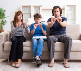 Concept of underage smoking with young boy and family