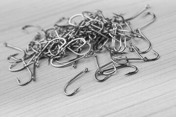 Close up, Pile of fish hooks on wooden background