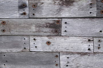 Obraz premium Gray wood planks with nail in interlocking pattern background and wallpaper texture