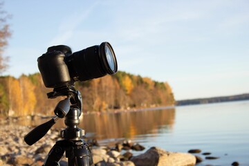View of the camera on tripod on the rocky beach
