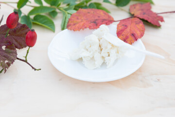 Shea butter on light background, unrefined, close up	