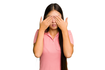 Young Asian woman isolated afraid covering eyes with hands.
