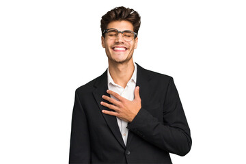 Young caucasian business man isolated laughs out loudly keeping hand on chest.
