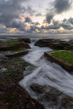 Wave water flowing between rocky channel. © AlexandraDaryl