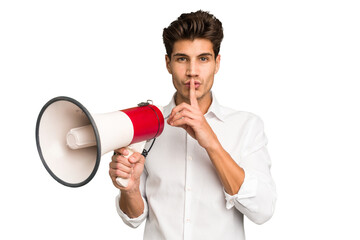 Young caucasian man holding megaphone isolated keeping a secret or asking for silence.