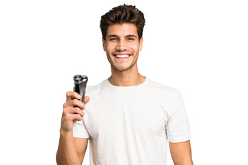 Young caucasian man holding a razor isolated happy, smiling and cheerful.