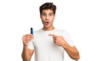 Young caucasian man holding an electronic cigarette isolated pointing to the side