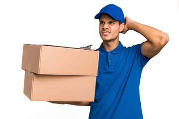 Young delivery caucasian man holding boxes isolated touching back of head, thinking and making a choice.