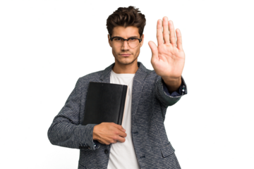 Young teacher caucasian man holding a book isolated standing with outstretched hand showing stop sign, preventing you.