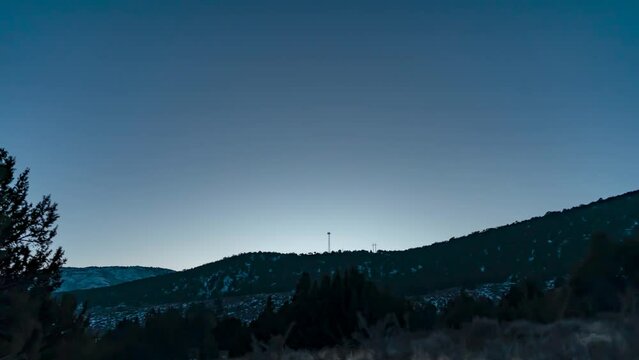 Day to night motion Milky Way time lapse in the Utah mountains in winter