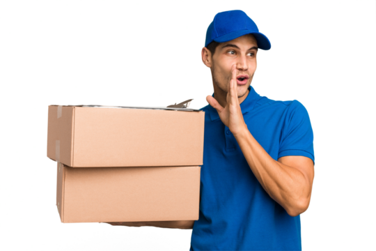 Young delivery caucasian man holding boxes isolated is saying a secret hot braking news and looking aside