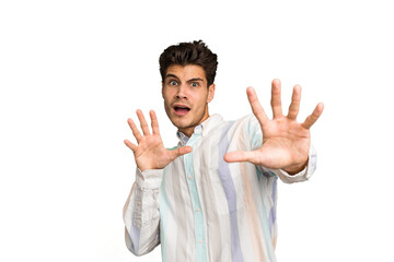 Young caucasian handsome man isolated being shocked due to an imminent danger