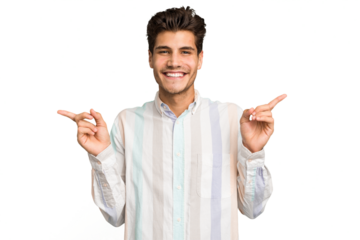 Young caucasian handsome man isolated pointing to different copy spaces, choosing one of them, showing with finger.